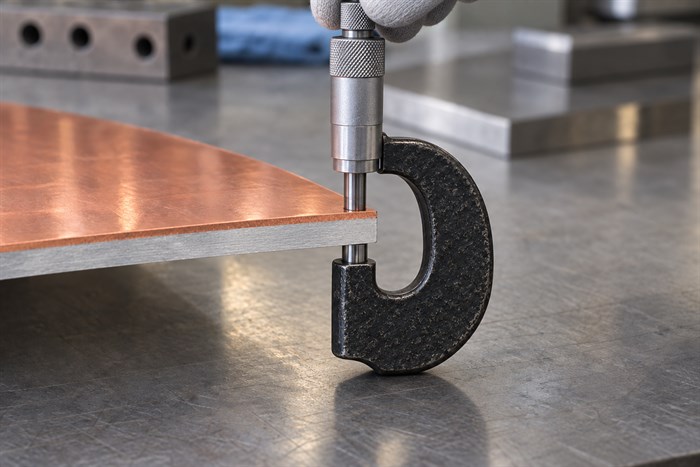 Outside micrometer measuring total copper-aluminium sheet thickness
